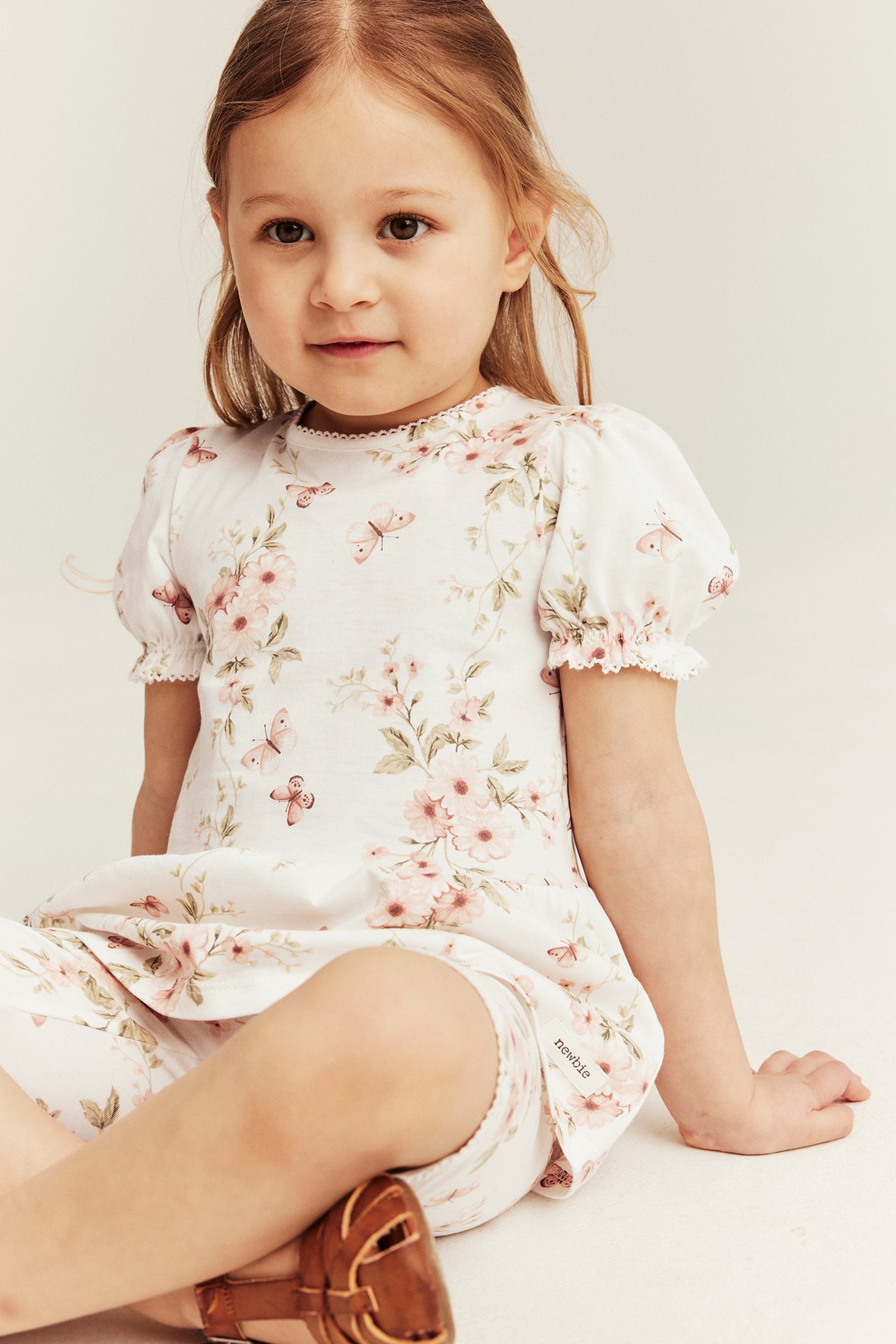 Top peplum w kwiaty i motyle