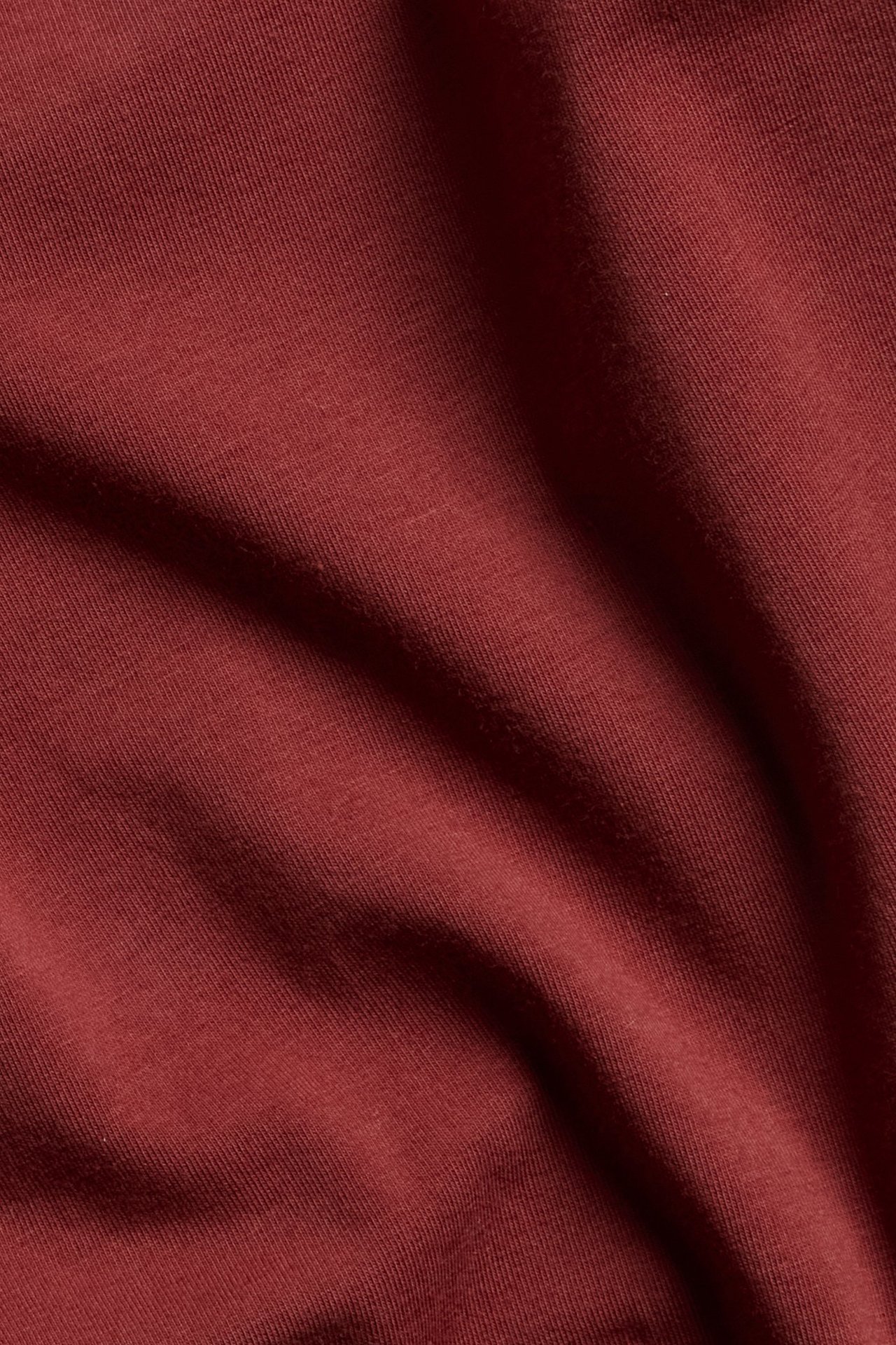 Czerwona długa bluzka z bawełny z elastanem, jednolita, widok z przodu.