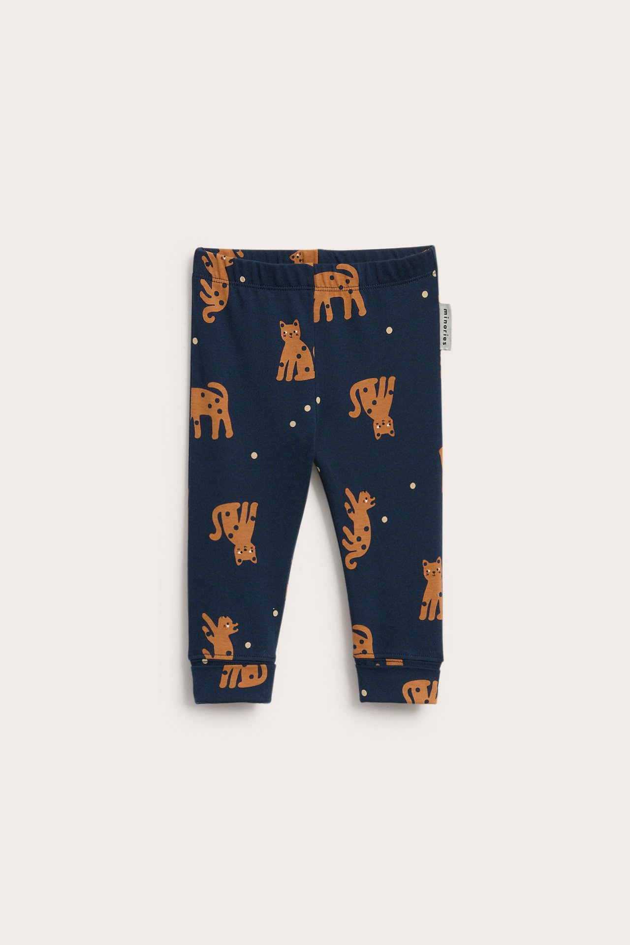 Frontvisning av mørkeblå ribbestrikkede baby-leggings med brunt leopardmønster, elastisk midje og mansjetter.