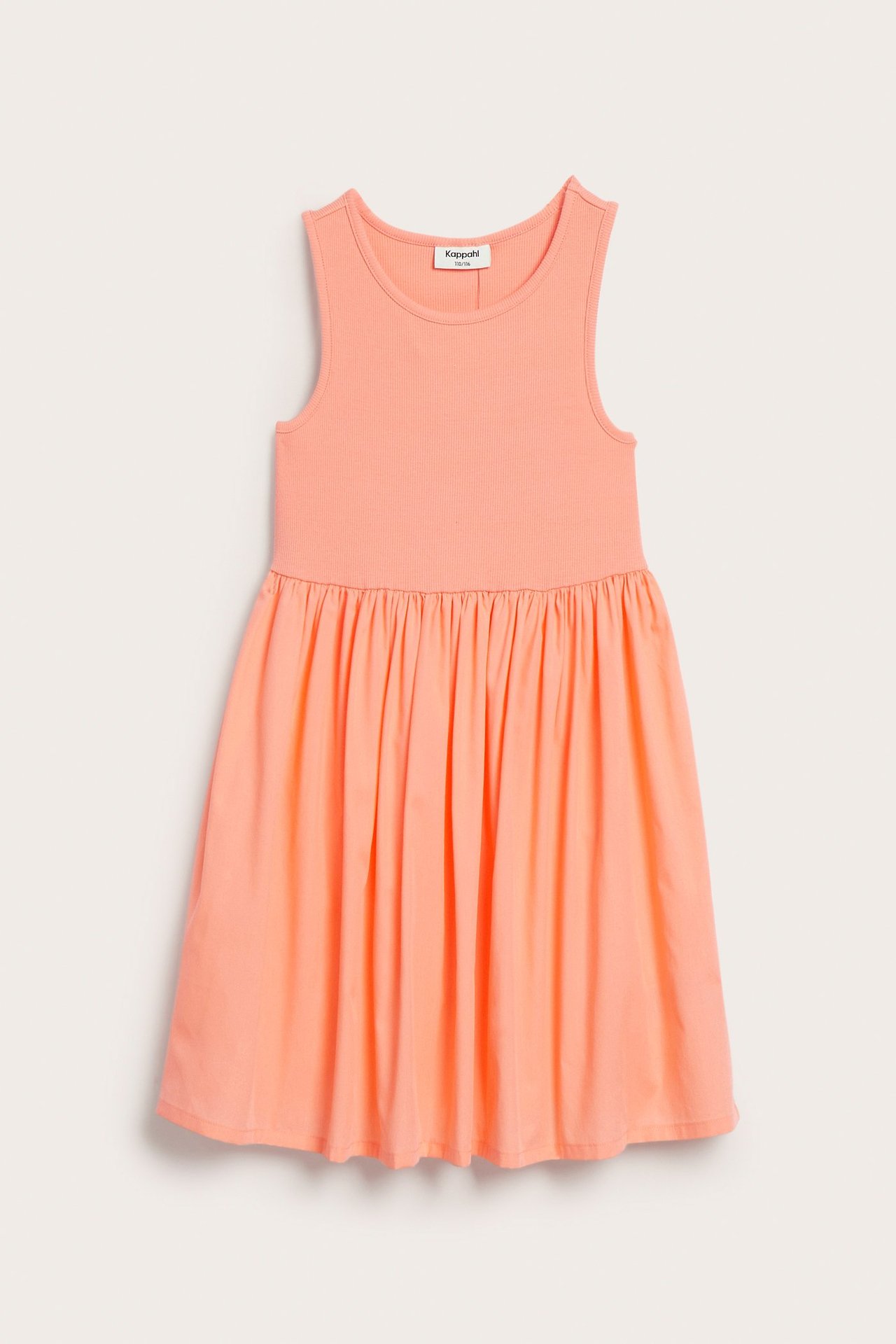 Jasnopomarańczowa bawełniana sukienka bez rękawów z topem z dżerseju i marszczoną spódnicą.