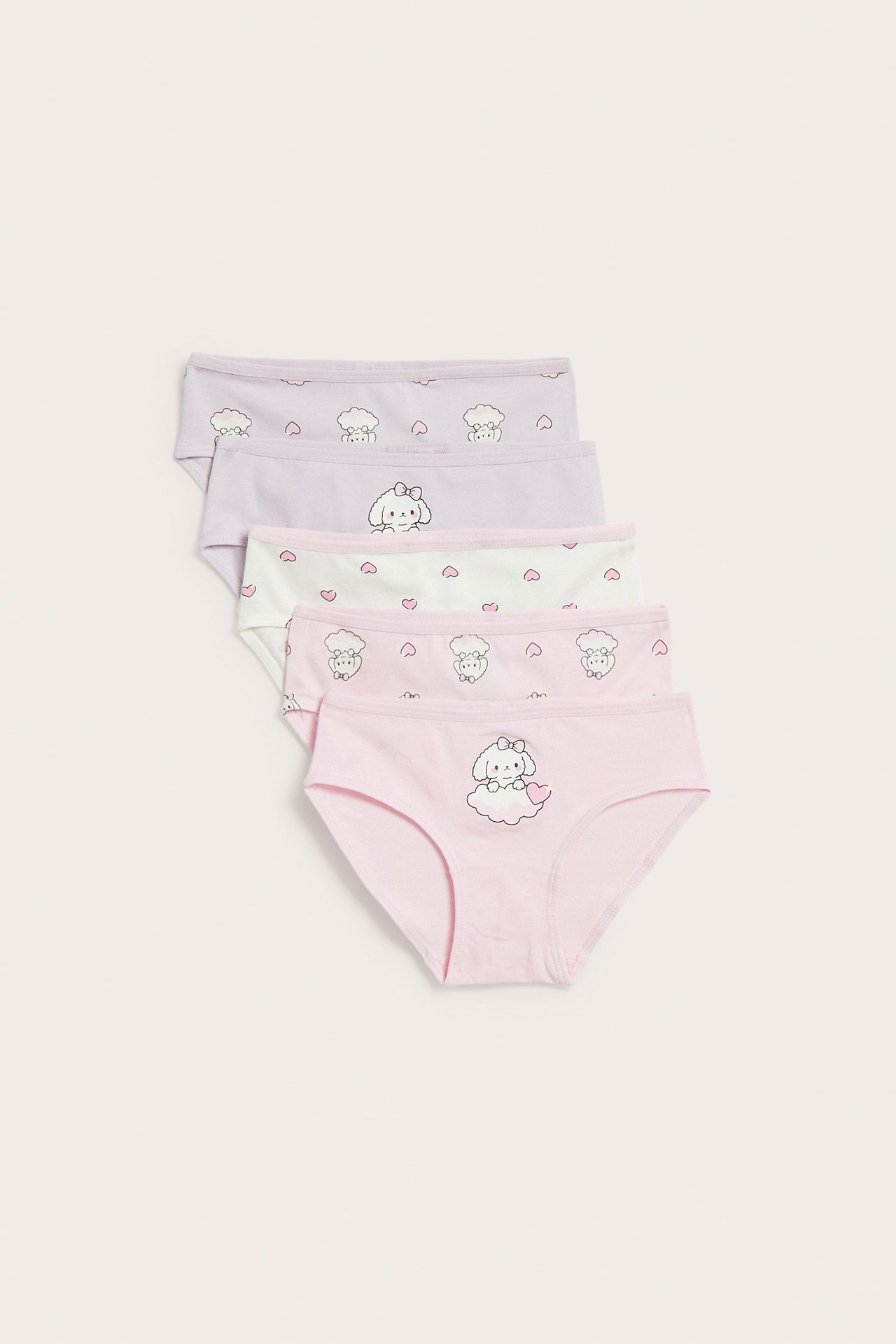 Widok z przodu na pięć par dziecięcych bawełnianych majtek w różowym, jasnozielonym i jasnofioletowym z różnymi wzorami.