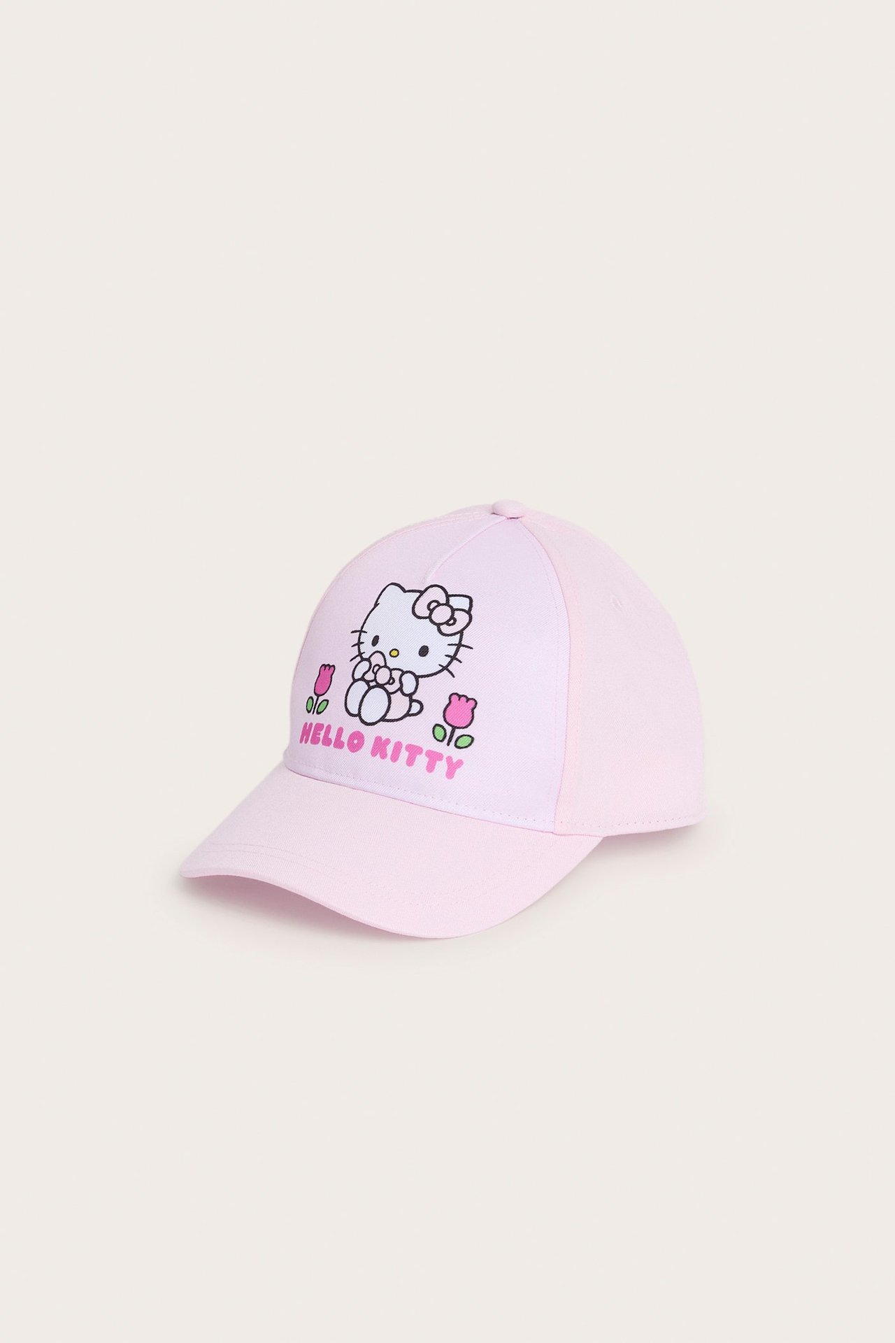 Jasnoróżowa czapka z daszkiem z nadrukiem Hello Kitty i napisem z przodu.