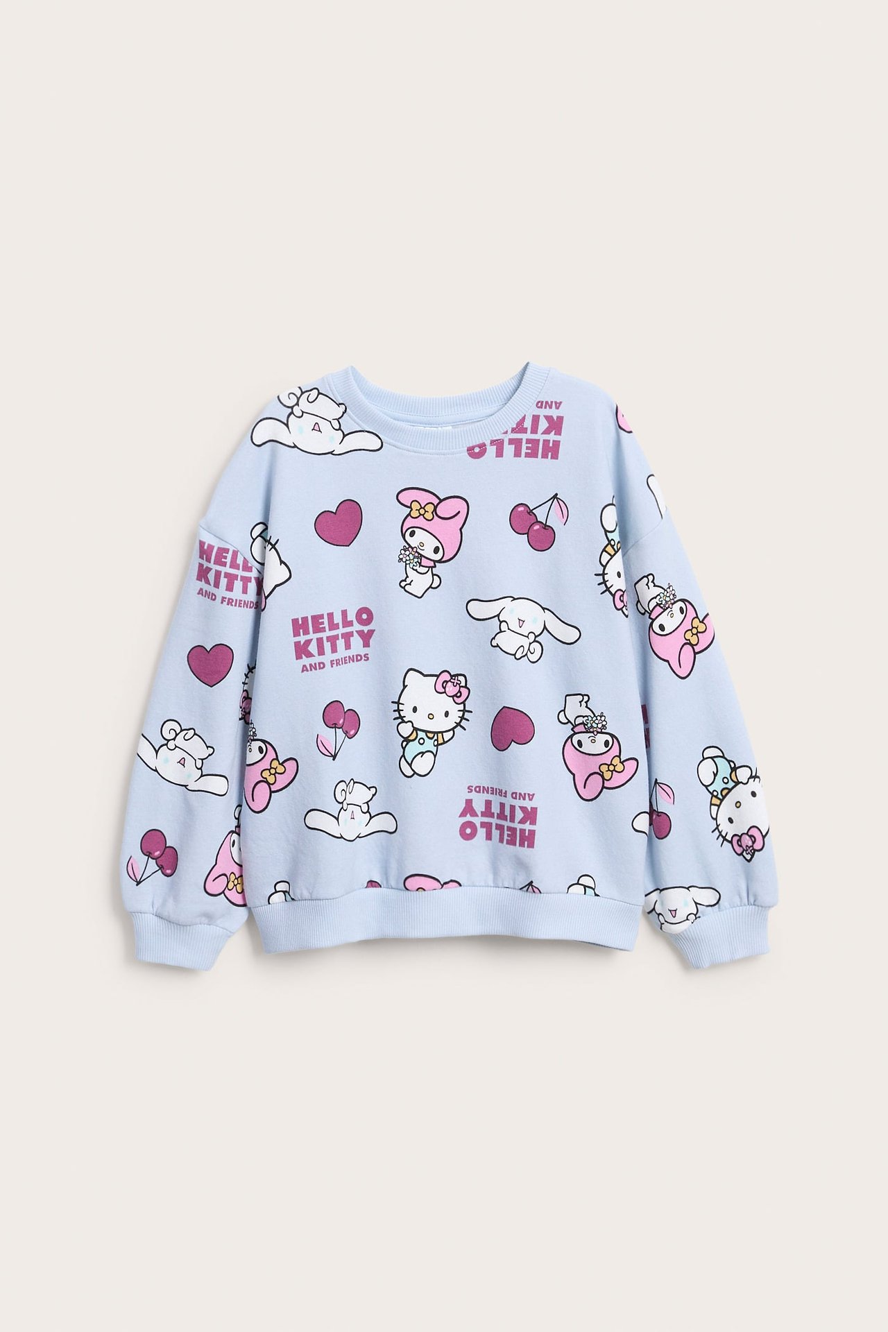 Z przodu, jasnoniebieska bluza dziecięca z nadrukiem Hello Kitty i przyjaciół.