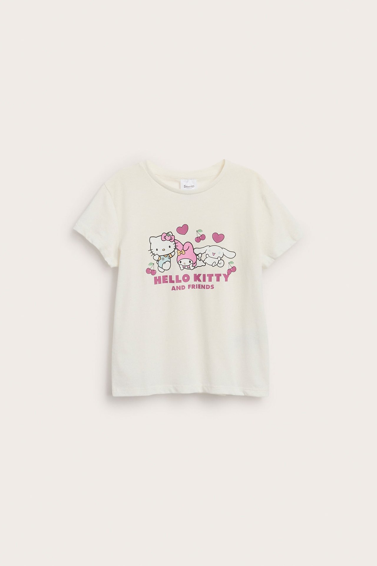 Widok z przodu kremowego T-shirtu z krótkim rękawem z nadrukiem Hello Kitty i przyjaciół.