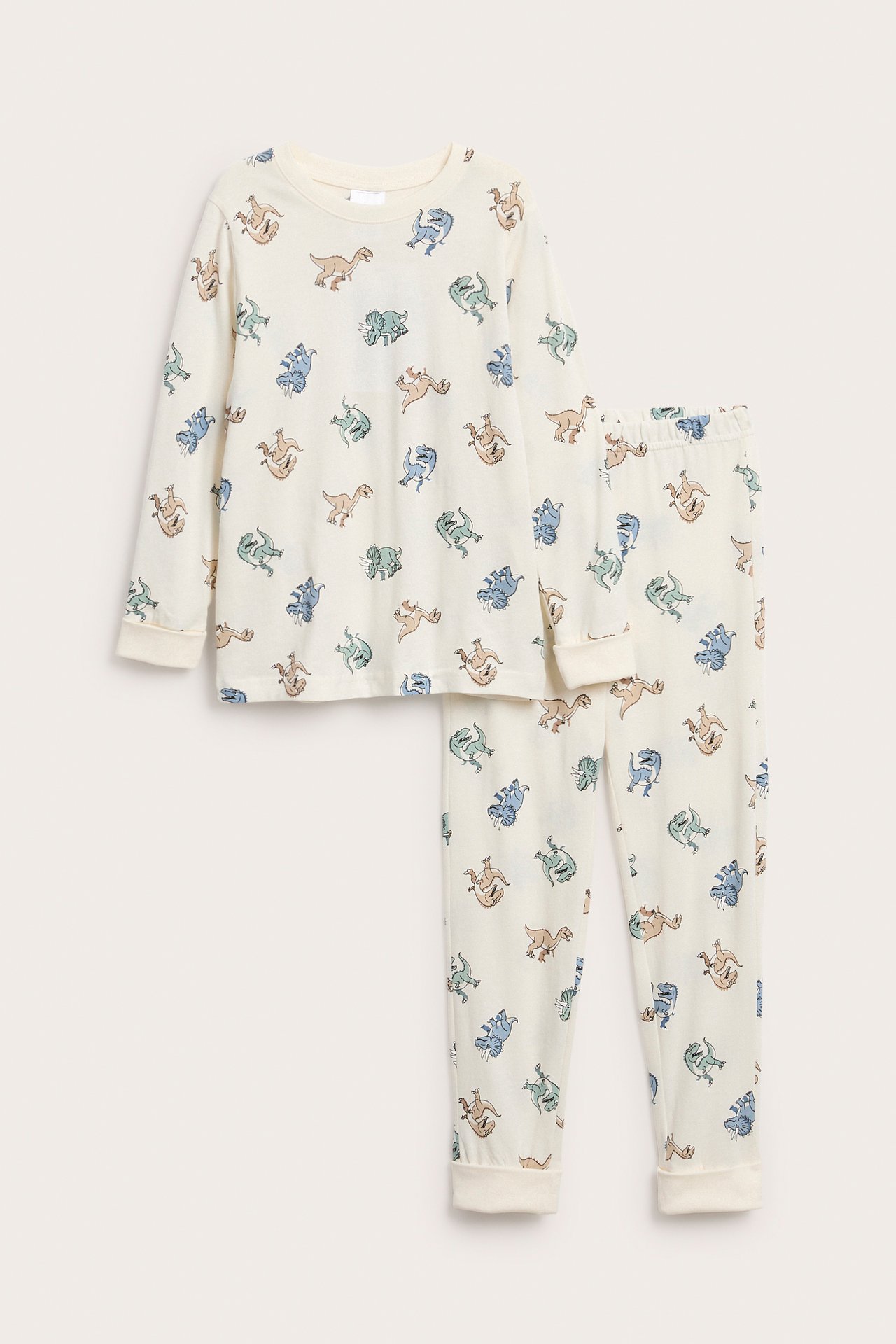 Offwhite bomullstrikåpyjamas för barn med långa ärmar och färgglatt dinosauriemönster.