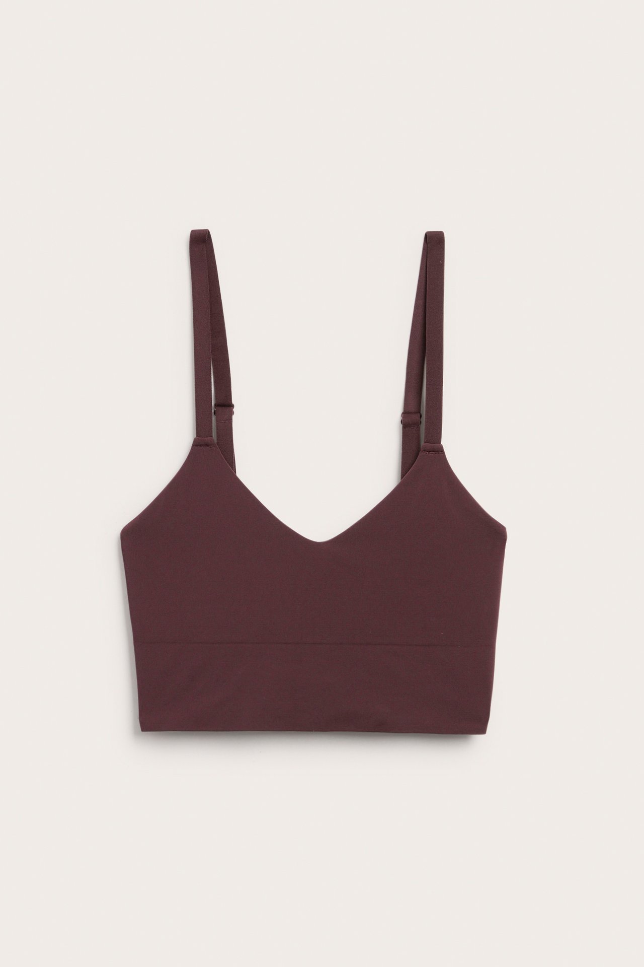 Widok z przodu bordowego biustonosza V-neck z regulowanymi ramiączkami i szerokim pasem.