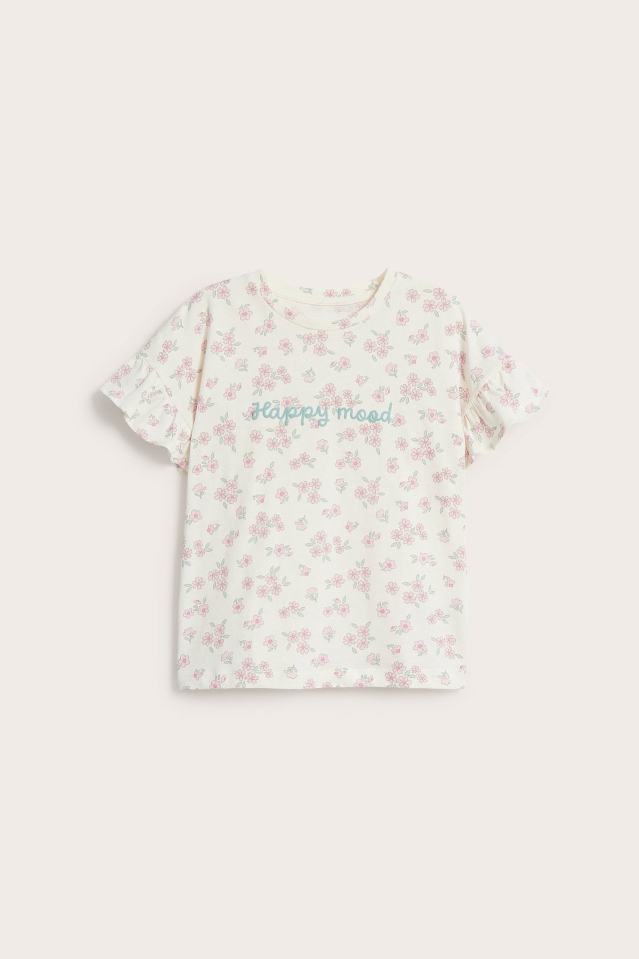 Widok z przodu: dziecięca koszulka T-shirt z bawełny ecru, z różowym wzorem kwiatowym, falbankami i napisem "happy mood".
