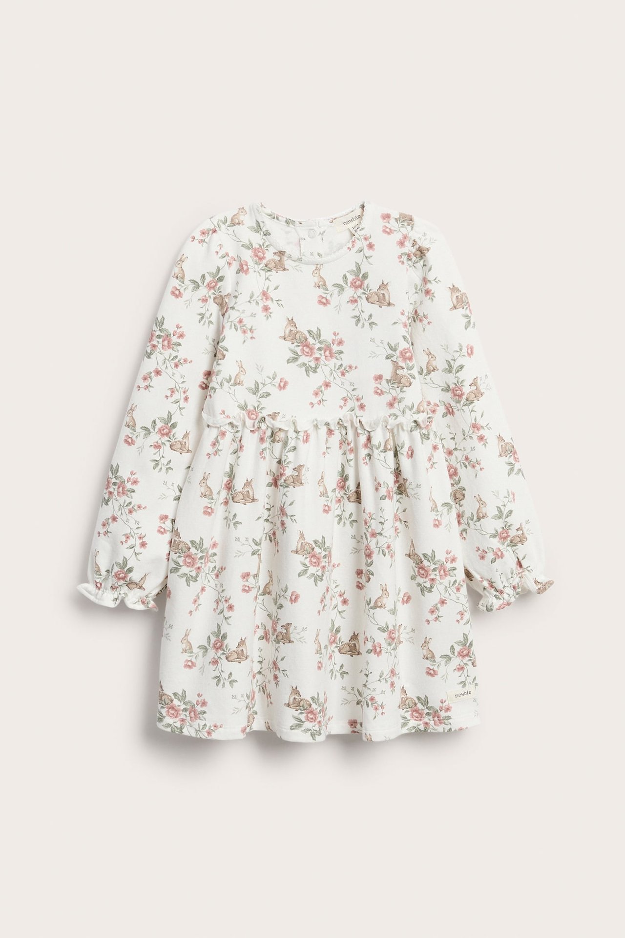 Forfra: Offwhite jerseykjole til barn med rosa blomster- og rådyrmønster, rynket midje og volangermer.