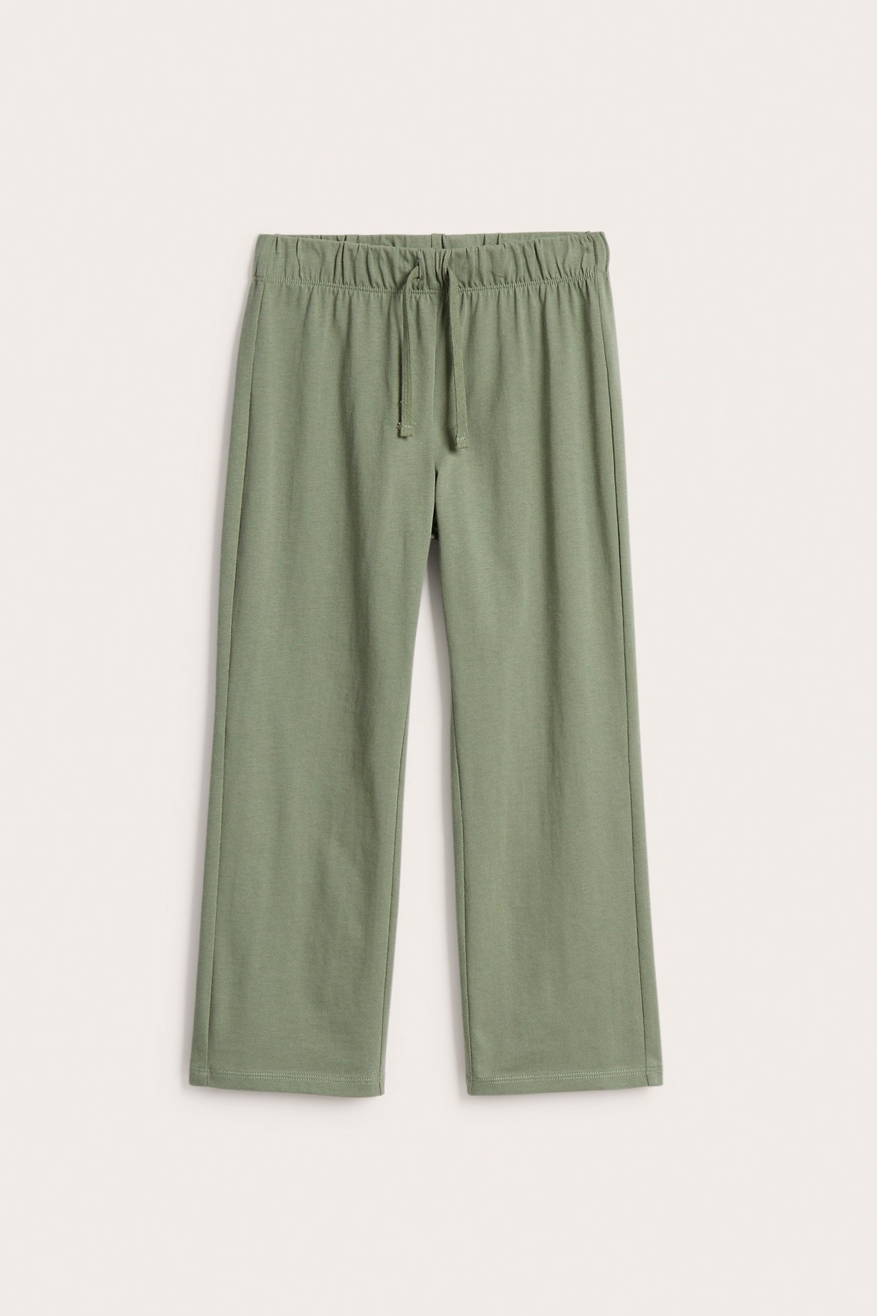 Edestä: tummanvihreät puuvillaiset suoralahkeiset collegehousut, joissa joustava vyötärö ja kiristysnyöri.