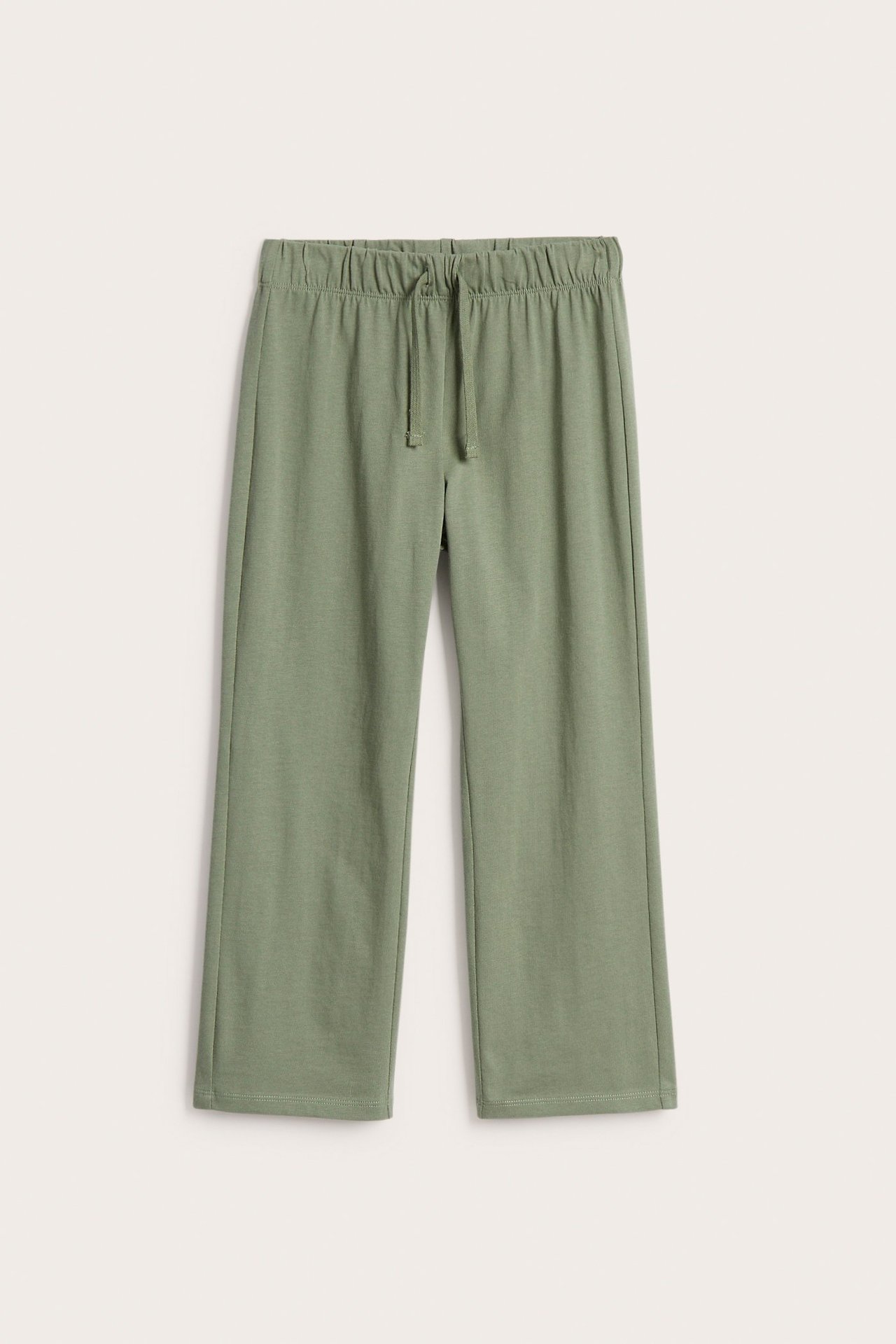 Edestä: tummanvihreät puuvillaiset suoralahkeiset collegehousut, joissa joustava vyötärö ja kiristysnyöri.