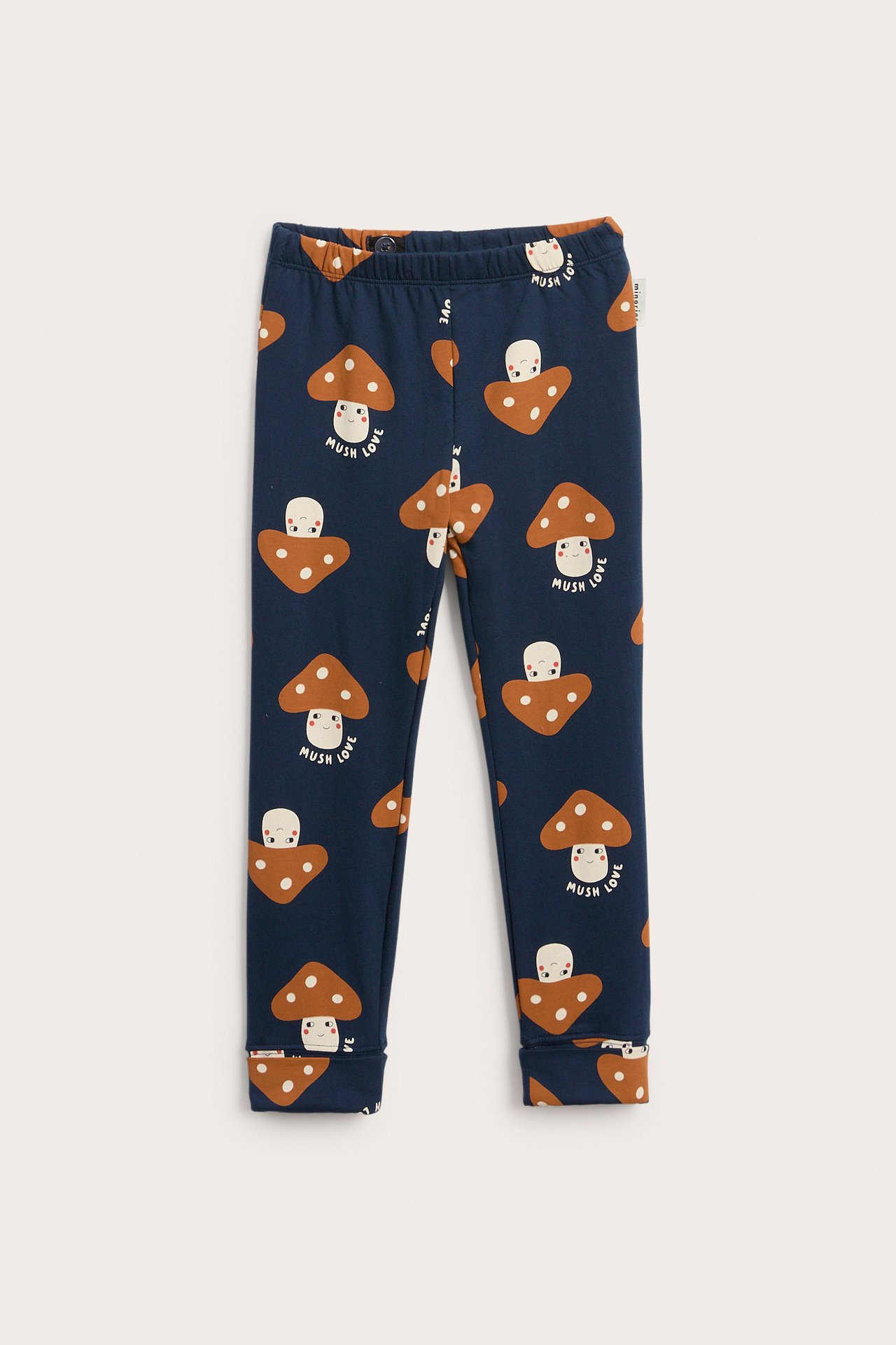 Laivastonsiniset lasten leggingsit ruskealla sieni- ja ”Mush Love” -printillä, edestä.