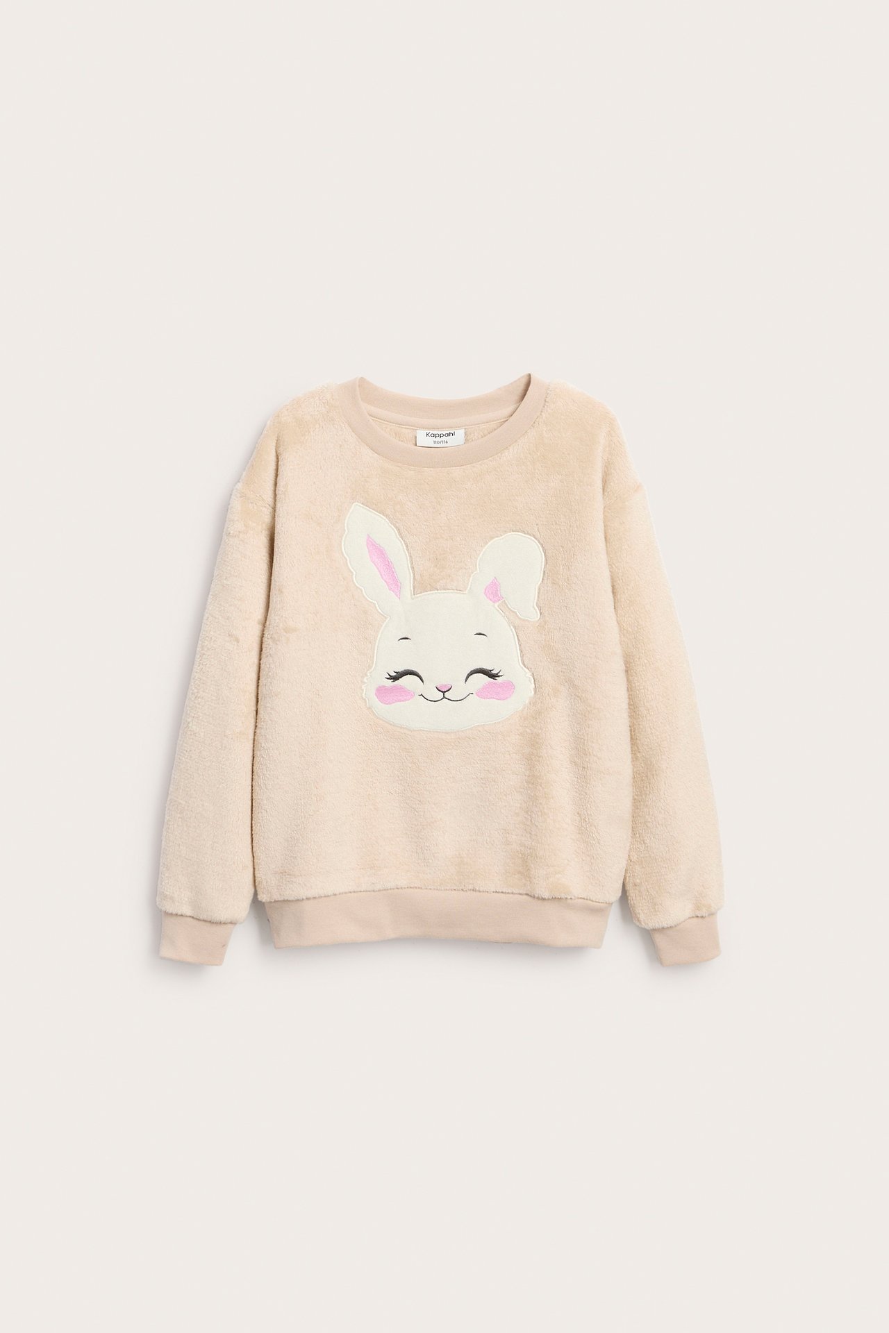 Frontvisning av en beige fluffy barnesweatshirt med en hvit kaninansiktapplikasjon.