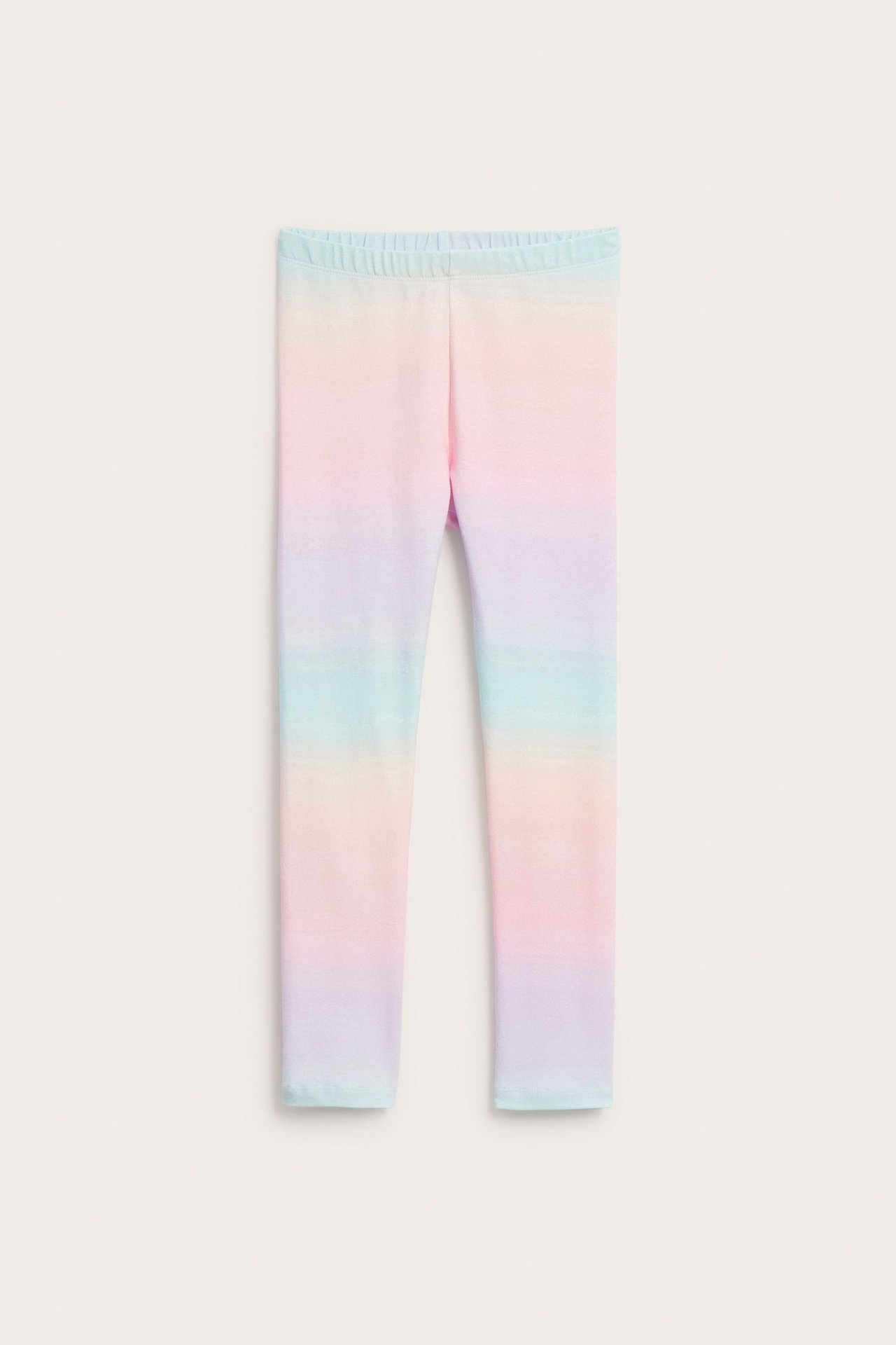 Przód, miękkie legginsy dziecięce z bawełnianej dzianiny, pastelowy tęczowy wzór ombre, elastyczny pas.