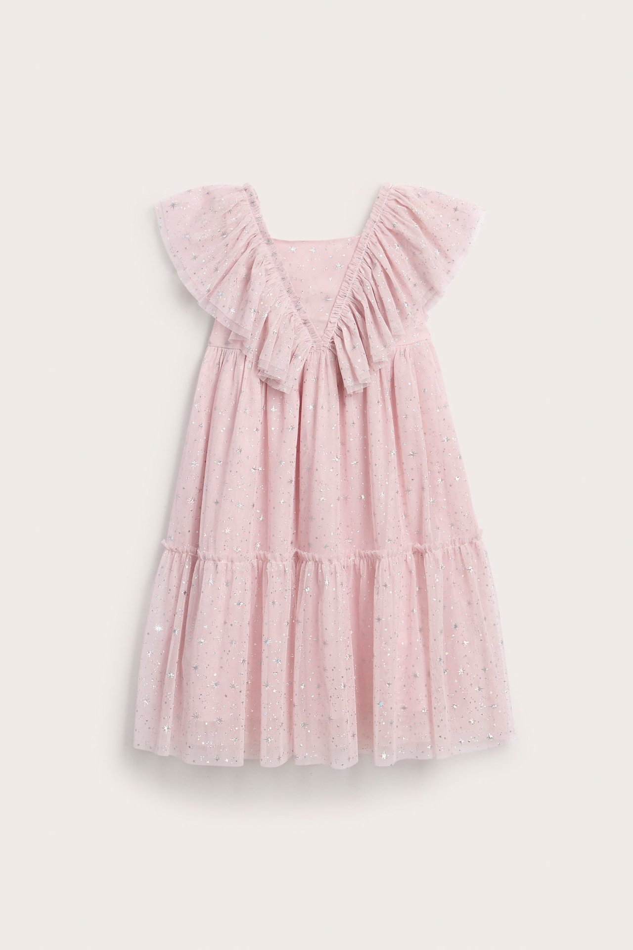 Frontvisning av en rosa barnekjole med volanger, lag og sølvstjerneglitter.