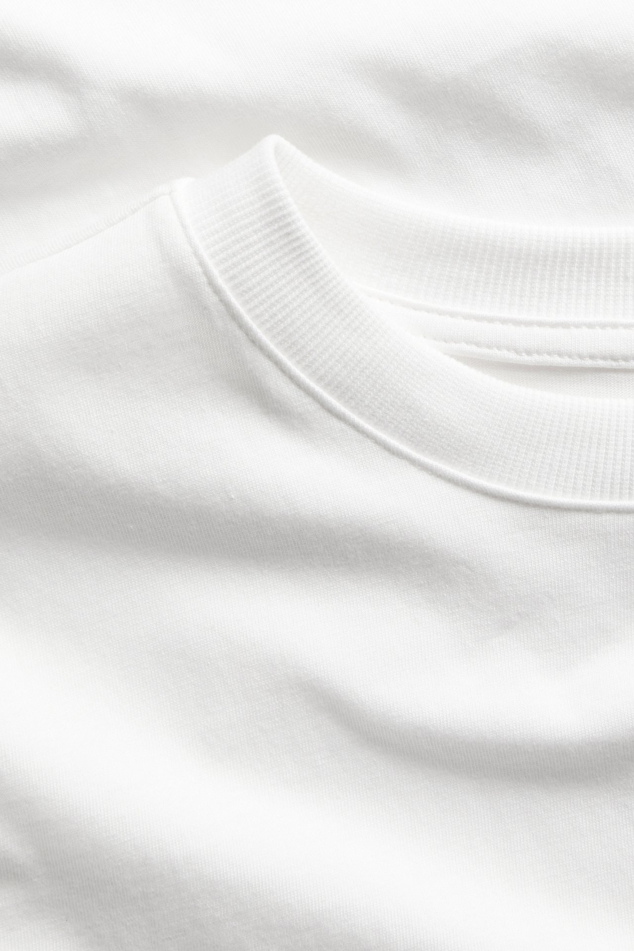 T-shirt i bomullstrikå med kort ärm